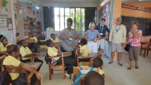 V.B.S. Leader, Dr. Dion Scotland, leading a Vacation Bible School class. Other missionaries are looking on.
