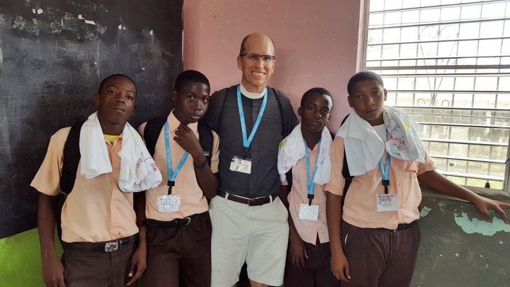 Father Jon with some of the male students at Queen's Square Anglican School.